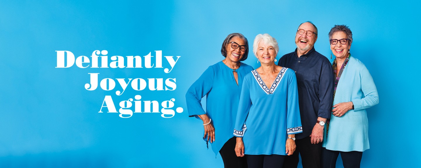 Homepage banner with Defiantly Joyous Aging and 4 people against a blue background